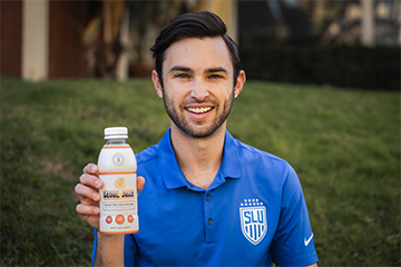 Luis Manta holds a bottle of his product, Seoul Juice, which he created while playing soccer at pro.